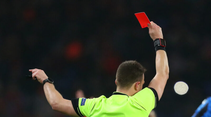 Referee showing a red card