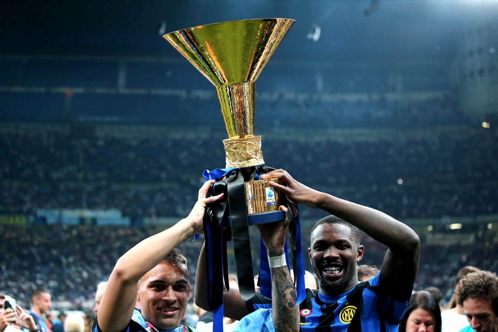Lautaro Martinez and Marcus Thuram lifting the Scudetto