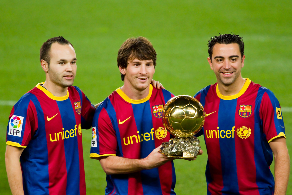 Andres Iniesta, Lionel Messi and Xavi