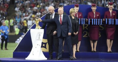 President of Russia Vladimir Putin, during the World Cup Champion Trophy Award Ceremony alongside FIFA President Gianni Infantino and Croatian President Kolinda Grabar