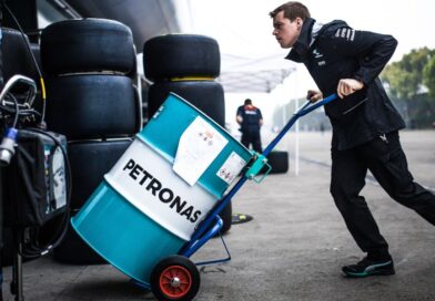 Racing engineer with Petronas barrel of fuel